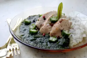 Egyptian Molokhya, Mulukhiyah, or Molokhia is served with Egyptian Rice
